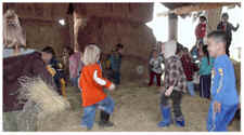 kids playing in barn
